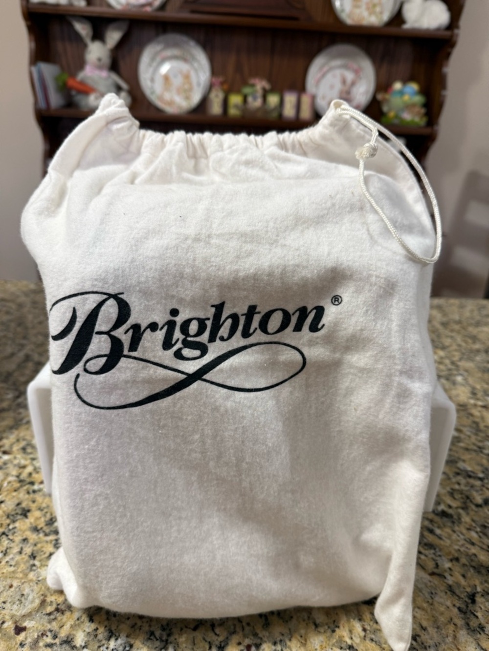 Brighton, purse, straw with brown leather straps. Measures.8 c 12”